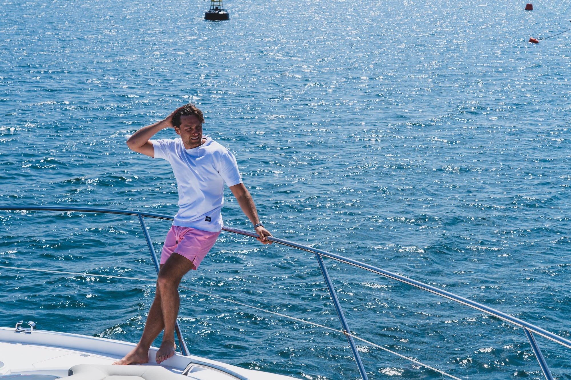 Casey O'Gorman Modelling James Cromwell London SS26 collection on a boat